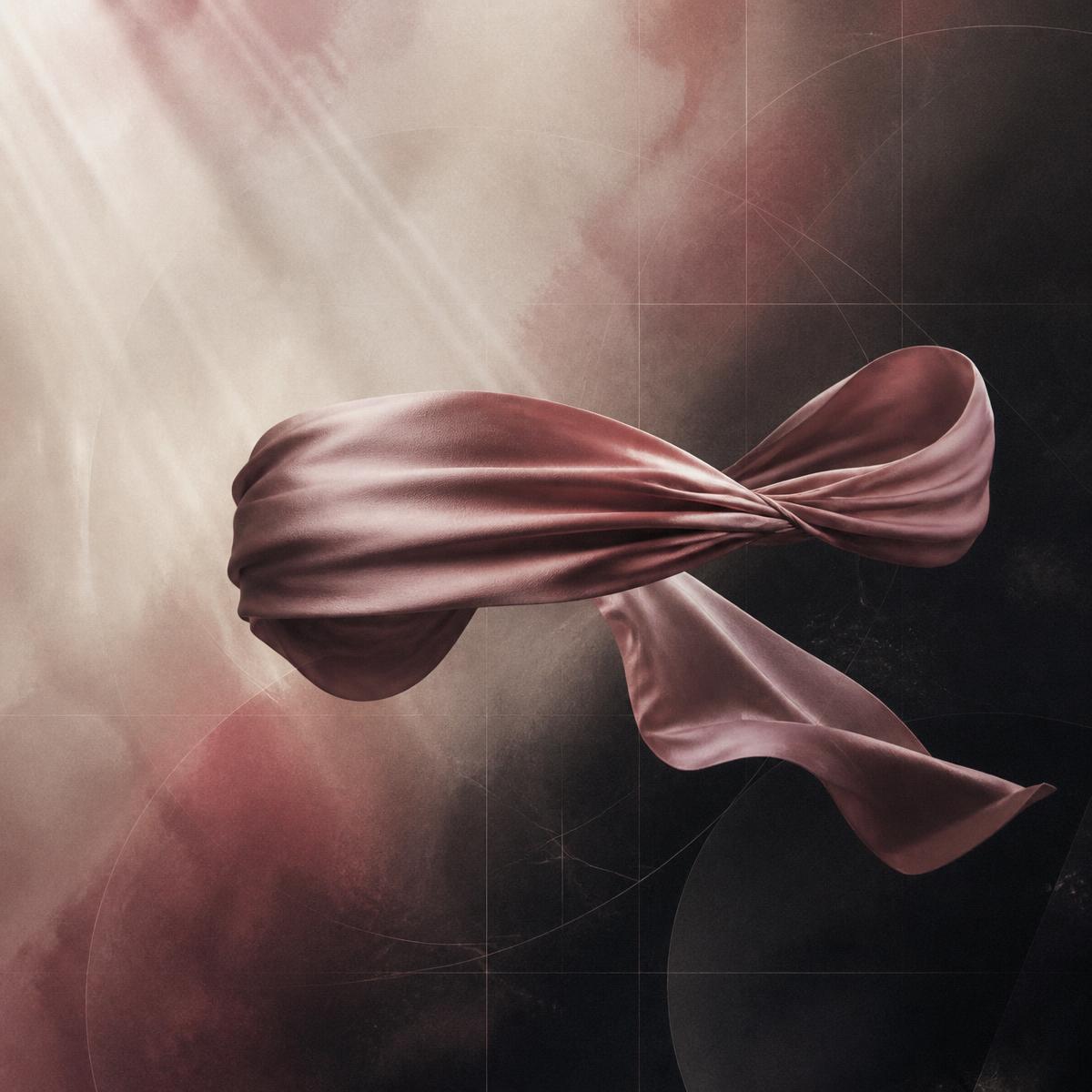 An abstract silk blindfold suspended in soft light against a dark, dissolving grid